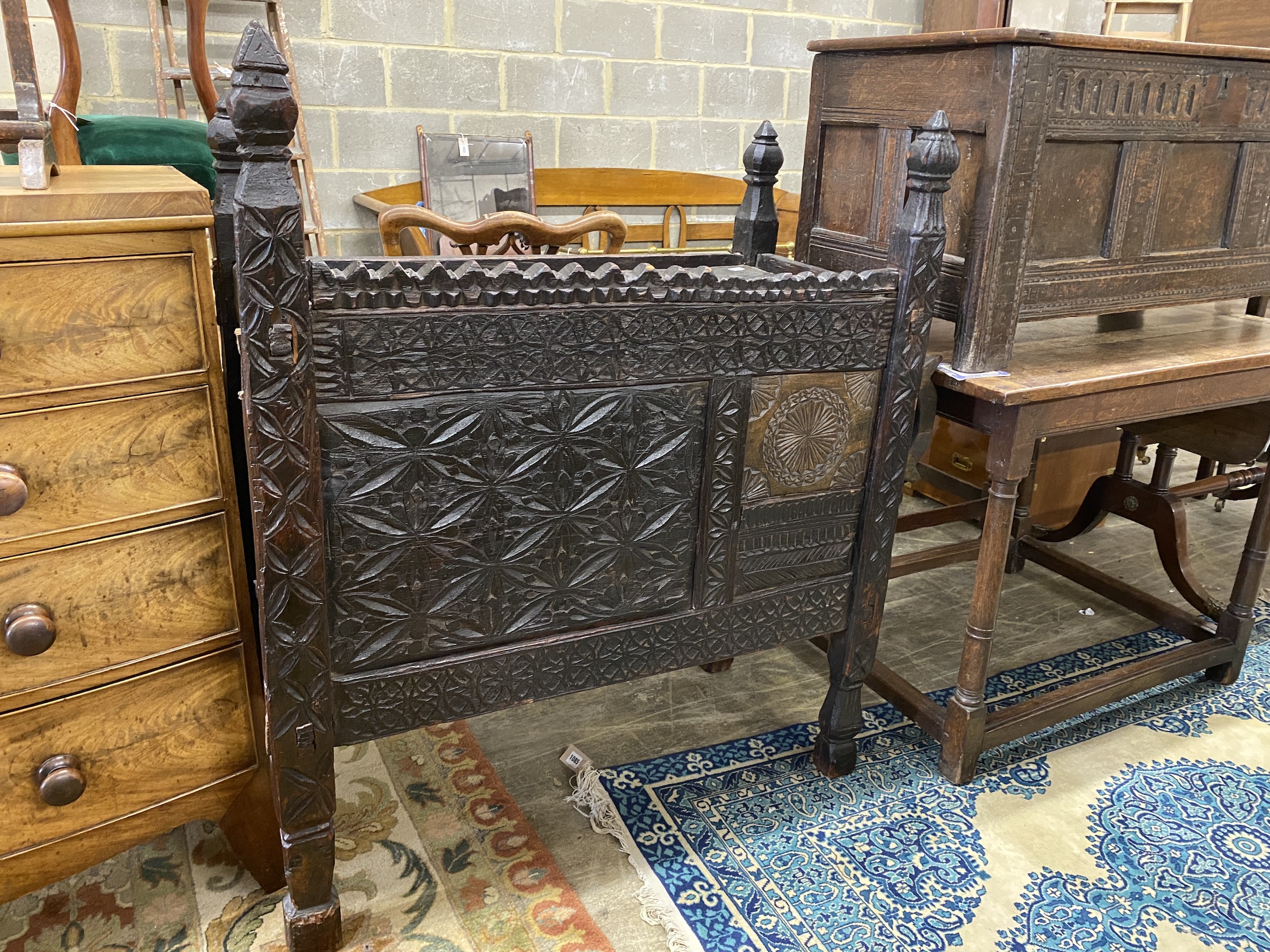 An Afghan chip carved hardwood chest, width 99cm, depth 48cm, height 116cm